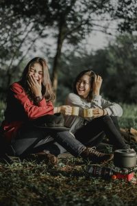 two girls sharing laughter