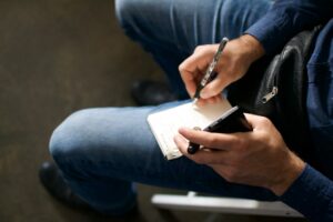 Reporter writing notes