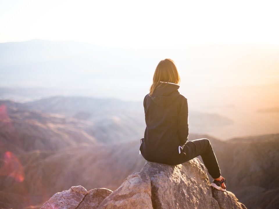 Woman on mountain top