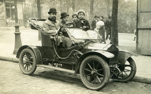 Historic picture of car and people in it